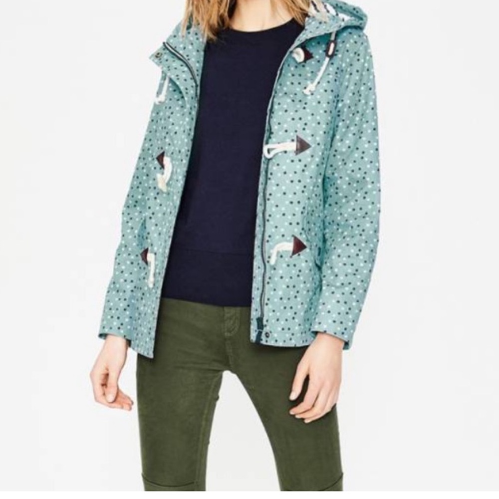 Light blue Boden raincoat with dark blue and white stars size 6